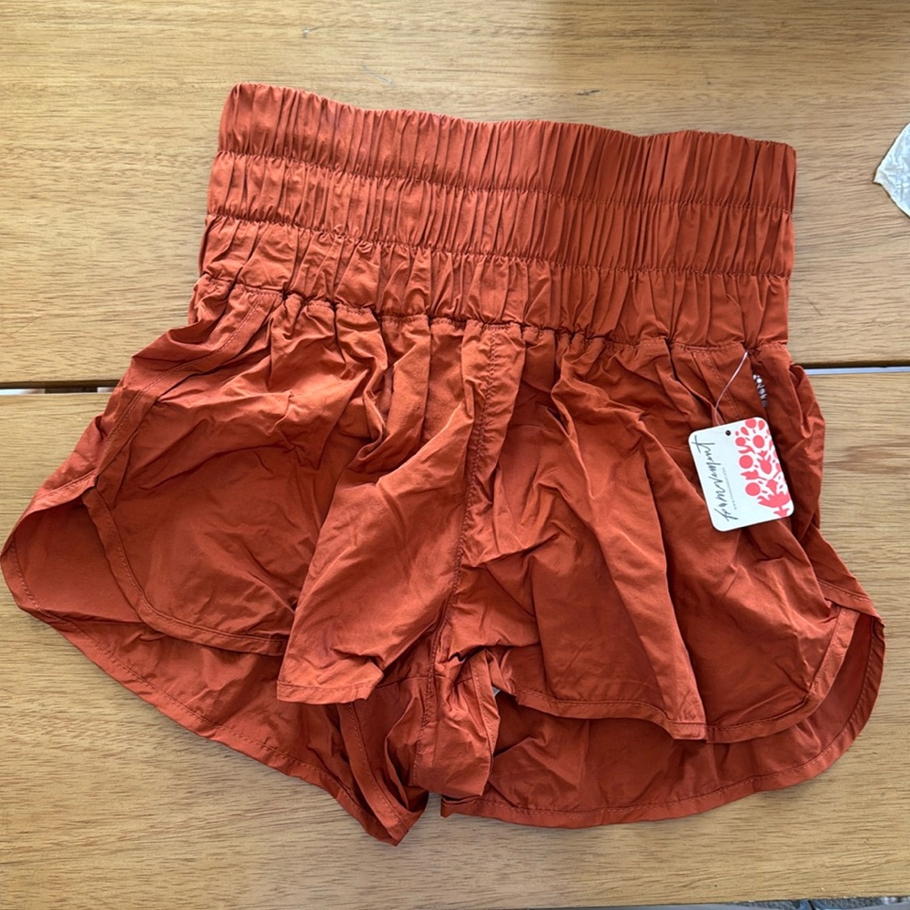 NEW with tags free people movement way home running short in rust orange • NWT